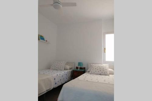 Postel nebo postele na pokoji v ubytování Apartamento frente al mar. Almuñécar