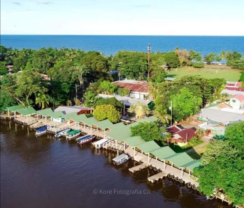 an aerial view of a resort on the water at Apartahotel & Gym Rondon in Tortuguero