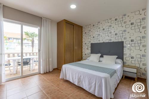 Postel nebo postele na pokoji v ubytování Apartamentos Turísticos Playa Mar I