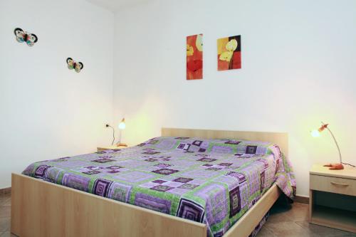 En eller flere senge i et værelse på Appartamenti Ideal