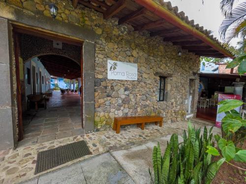 a stone building with a bench in front of it at Hotel Hacienda San Bartolo in Xico