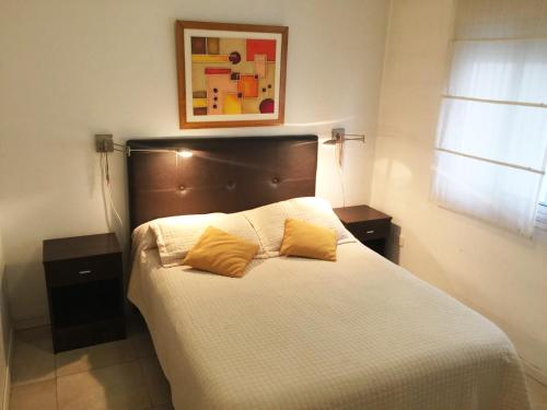 Кровать или кровати в номере Departamento 2 ambientes en Palermo - para 4 personas