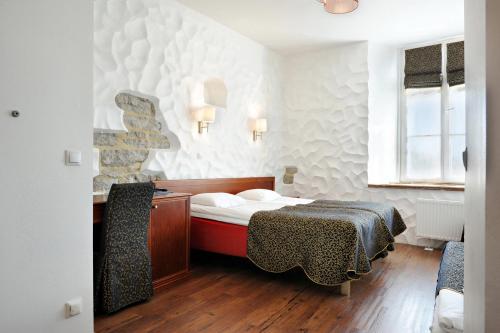 Postel nebo postele na pokoji v ubytování Gotthard Residents