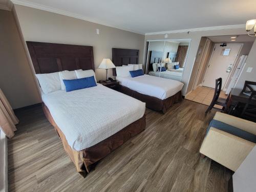 A bed or beds in a room at Direct Oceanfront Suite Caravelle Resort 615 Sleeps 4 Guests