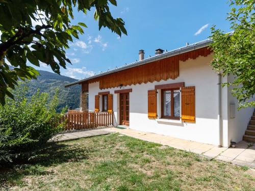 a house with a view of the mountains at Modern Holiday Home in Montagny with Balcony in Montagny