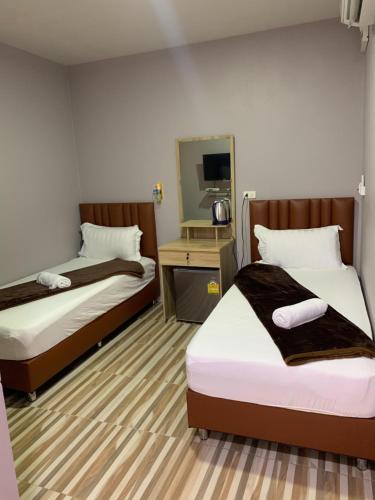 Postel nebo postele na pokoji v ubytování Green House Resort Praduyuen