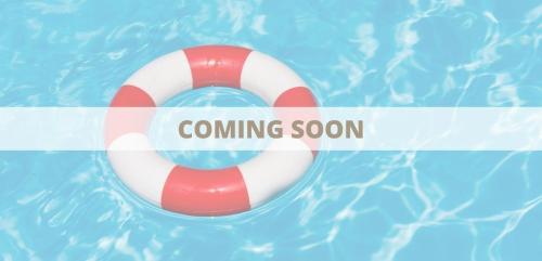 a red and white life preserver in a swimming pool at Raia Hotel & Convention Centre Kuching in Kuching
