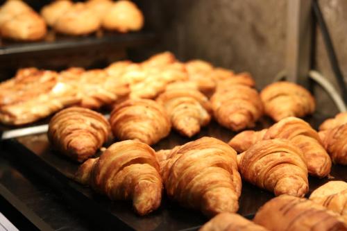 a bunch of croissants and other pastries in an oven at Fortune Park Galaxy, Vapi - Member ITC Hotels' Group in Vapi