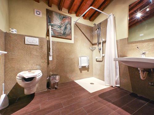 a bathroom with a toilet and a sink and a shower at Fattoria Casagrande in Rignano sullʼArno