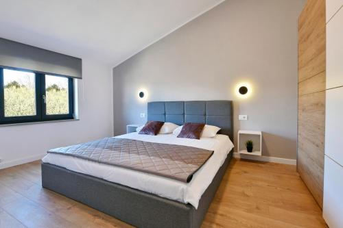 Ένα ή περισσότερα κρεβάτια σε δωμάτιο στο R2 Apartment by Residence Rudan