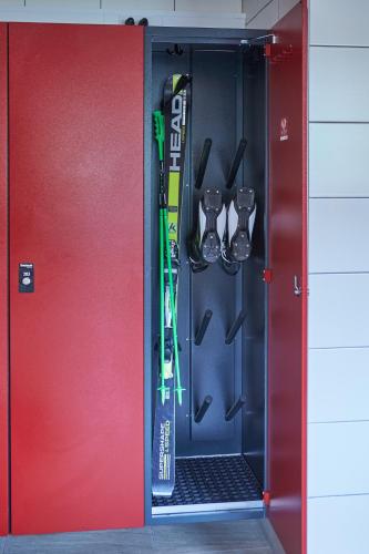 a door with a pair of skis and ski equipment at Am Mitteregghof in Saalbach Hinterglemm