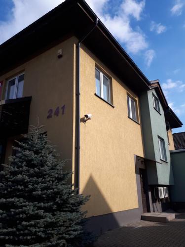 a bird is perched on the side of a house at ApartsW241 in Jelenia Góra