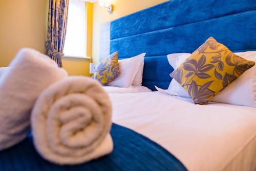 Ένα ή περισσότερα κρεβάτια σε δωμάτιο στο Stonecross Manor Hotel