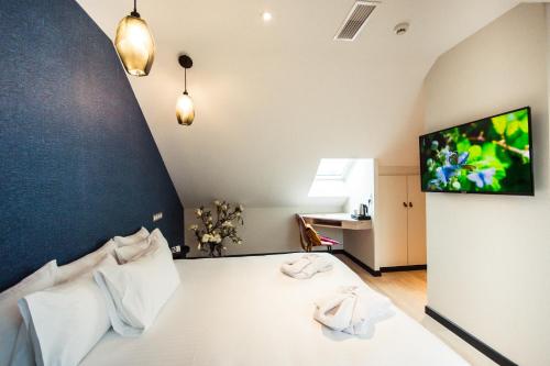 Postel nebo postele na pokoji v ubytování Logis Villa C Hôtel