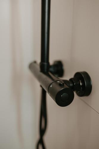 a black object is hanging on a wall at Bed en Baguette in Burgh Haamstede