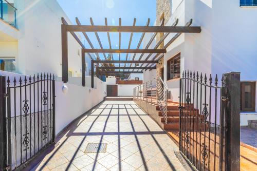 an entrance to a house with an iron gate at Seafront Protaras Villas in Protaras
