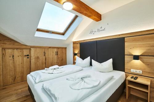 Uma cama ou camas num quarto em Hotel Rupertihof