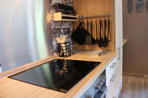 a kitchen with a stove top oven in a kitchen at Pension Kärnten in Seeboden