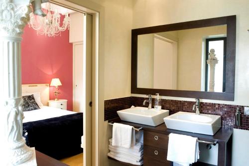 a bathroom with two sinks and a large mirror at 1208 - EXCLUSIVE DESIGN APARTMENT in Barcelona