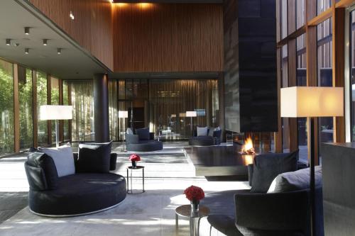 a lobby with couches and chairs in a building at Barvikha Hotel & Spa - The Leading Hotels of the World in Barvikha