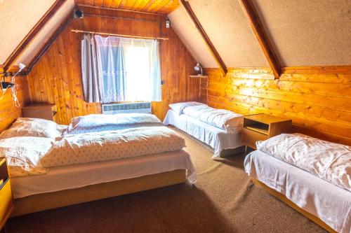 Postel nebo postele na pokoji v ubytování Turistická Chata Chopok