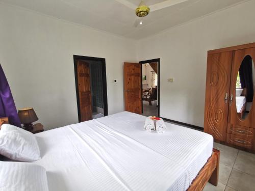 Ένα ή περισσότερα κρεβάτια σε δωμάτιο στο CHEZ MARVA Grande Villa COCO 3 à 12 personnes