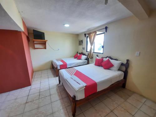 En eller flere senge i et værelse på Hotel Costa Maria