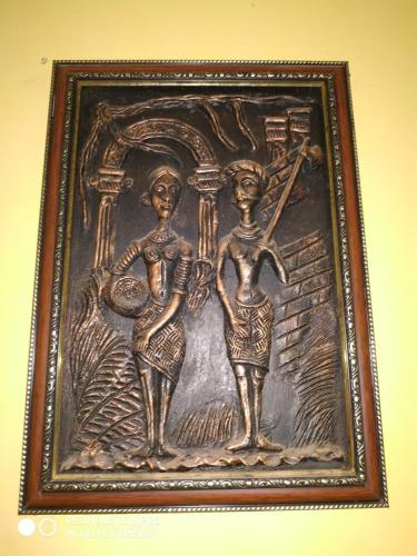 a picture of two people in a picture frame at Tranquil Hospitality with Breakfast in Bhubaneshwar