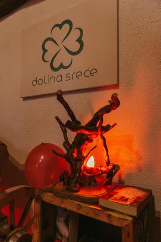 a metal statue of a person standing on a table at Etno Village Dolina Sreće in Vitez