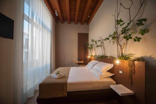Postel nebo postele na pokoji v ubytování Antica Dimora Luxury Rooms