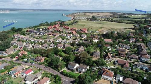 an aerial view of a residential suburb next to the water at Rockstone Cottage in Freshwater