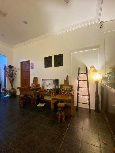 a room with a wooden table and a ladder at Ardour Lodge "B" Wing in George Town