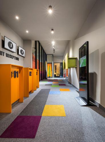 a hallway with a colorful floor in a building at Hotel Urban in Plovdiv