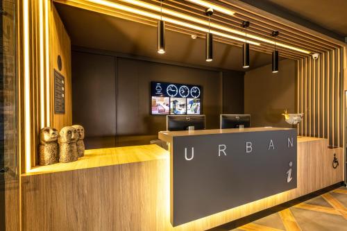 a udararma store with a sign on the counter at Hotel Urban in Plovdiv