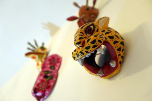 a fake toy of a jaguar with its mouth open at Majikal B&B - Guatemaya in Cholula