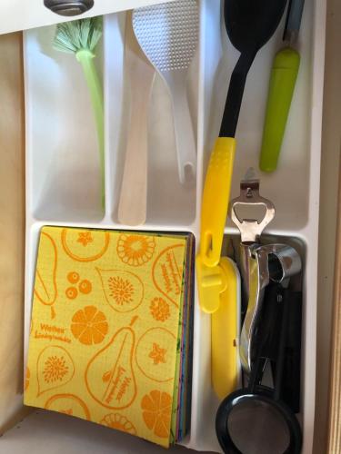 a drawer with some kitchen utensils in it at Holiday House with beautiful scenery near Göta Kanal in Undenäs