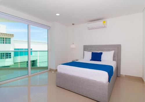 A bed or beds in a room at Playa Norte Hotel