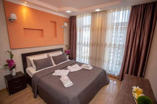 Кровать или кровати в номере Lux Apartment