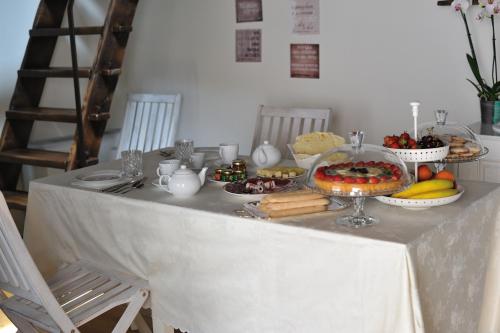 a table with a buffet of food on it at B&B e Home Restaurant S'ispera Monolocale uso esclusivo in Fonni