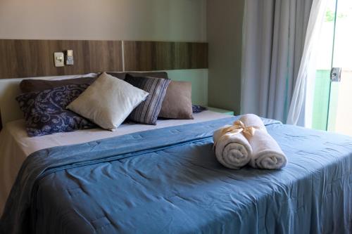 A bed or beds in a room at Apartamento Capitães de Areia Ilheus