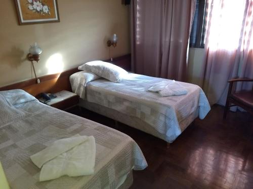 Cama o camas de una habitación en Hotel El Circulo