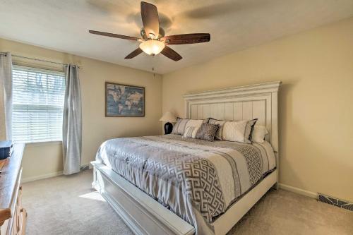 a bedroom with a bed with a ceiling fan at Lexington Home about 2 Mi to University of Kentucky! in Lexington