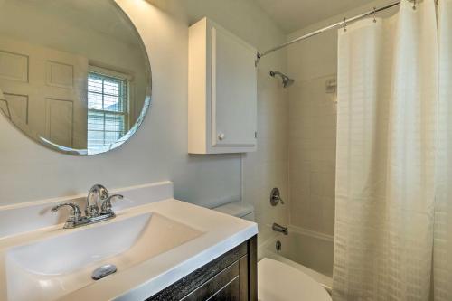 a bathroom with a sink and a mirror and a shower at Lexington Home about 2 Mi to University of Kentucky! in Lexington