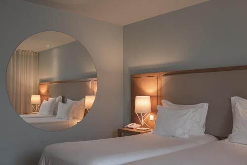 Кровать или кровати в номере Burgus Tribute & Design Hotel