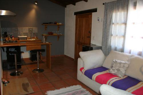 a living room with a couch and a table at Cabañas Boutique Villaseñor Pet and 420 Friendly in Huasca de Ocampo