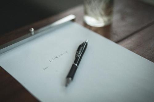 a pen sitting on top of a piece of paper at BENJAMIN HOTEL KANAZAWA in Kanazawa