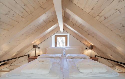 a bedroom with a large bed in the attic at Cozy Home In Omis With Kitchen in Omiš