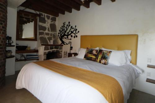 Una cama o camas en una habitación de Casa Acento