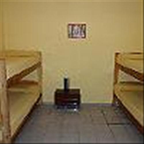 an empty room with two bunk beds in it at Mitre Suites in Buenos Aires