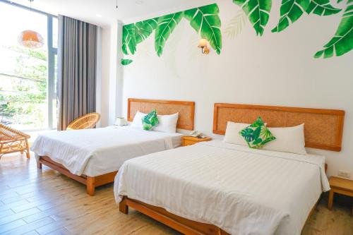 Giường trong phòng chung tại Viva Hotel Phú Yên